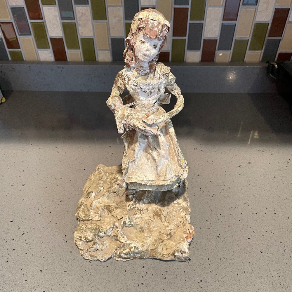 Vintage paper mache woman with baby sculpture